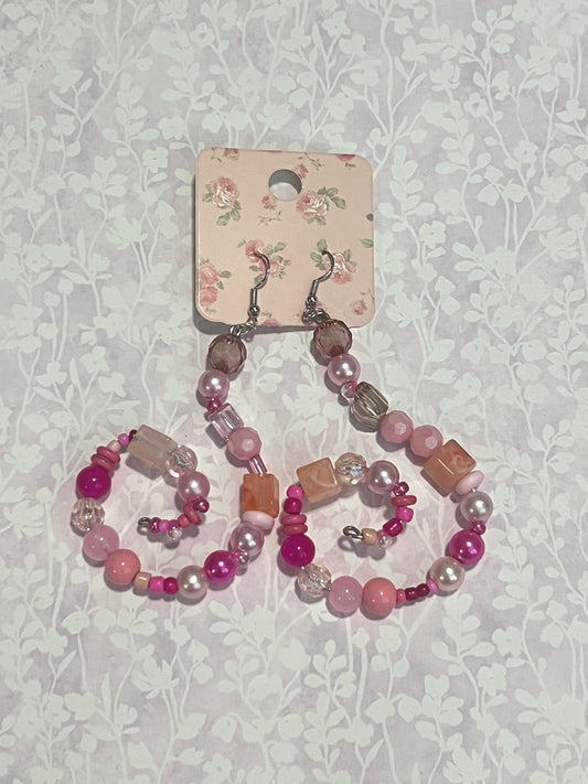 Pink beaded swirl earrings